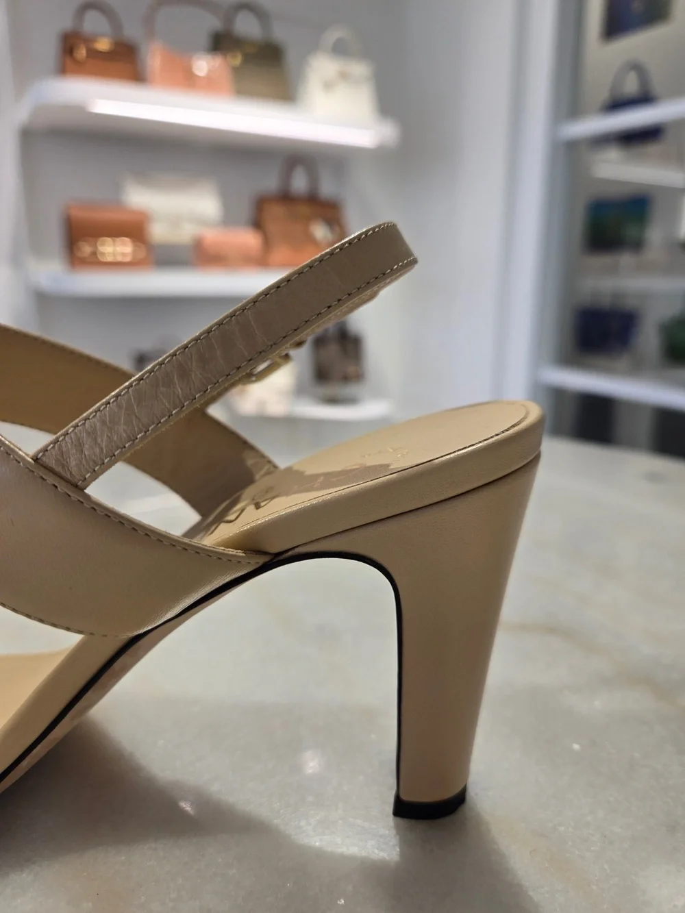 CHANEL Beige Slingback Heels with Black-and-Gold Chain